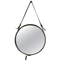 Round mirror by Jacques Adnet