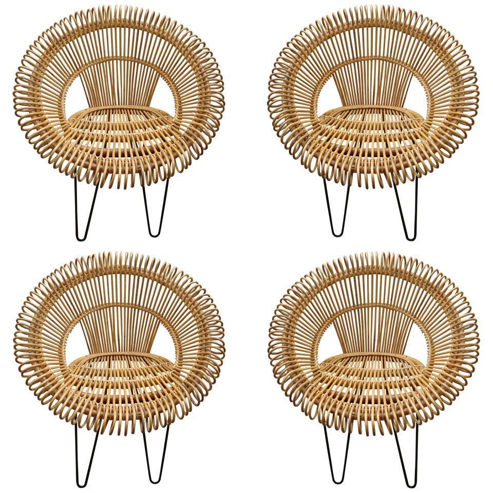 Four 1950's Armchairs In Rattan And Black Lacquered Iron