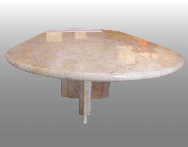 Sculptural table in clear Rosso marble. Made on special order for Knoll International.