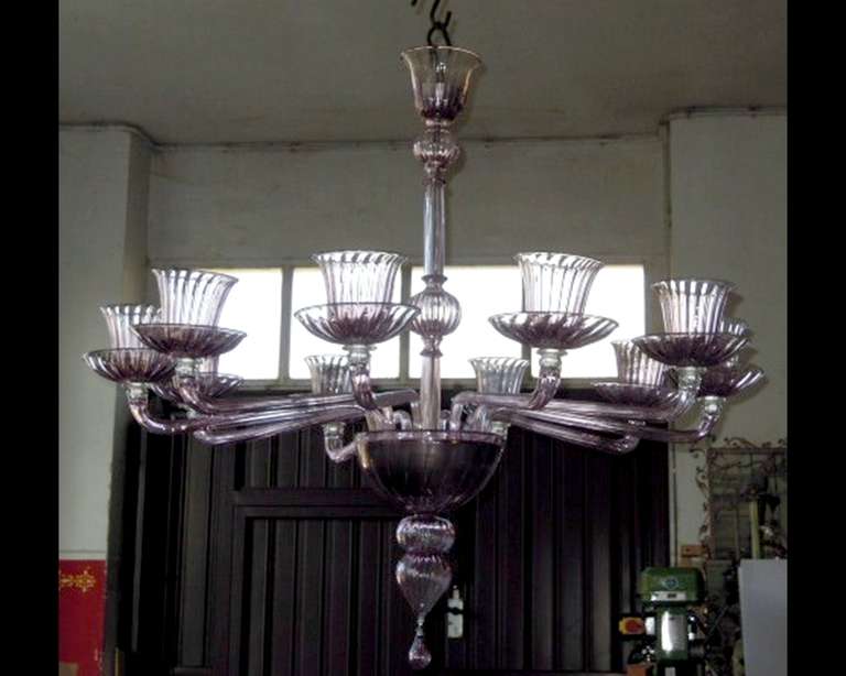 Beautiful chandelier with ten arms in clear amethyst blown glass by Venini in Murano. Italy 1970.
In perfect condition.