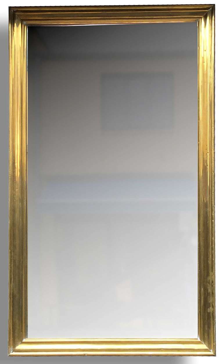 Important and rare bar mirror, from the late nineteenth century, brass frame, mirror and original background in wooden parquet. 
