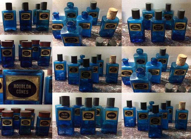 Rare set of rectangular pharmacy jars in blue blown glass, with original labels in black and gold églomisé glass. Caps are in lacquered iron sheet.