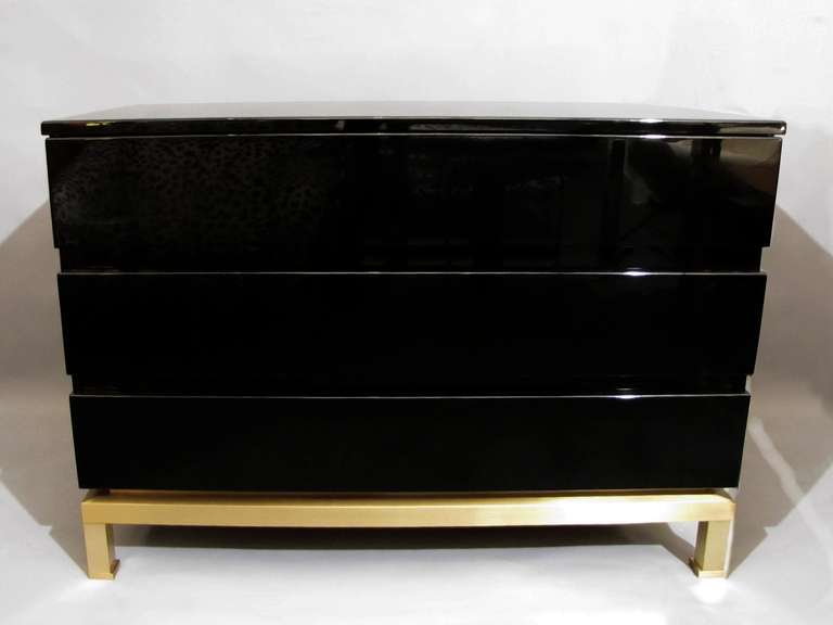 Two beautiful commodes by Guy Lefevre for Maison Jansen, in black lacquered wood and polished brass. Back and interior of drawers in Sapelli wood.