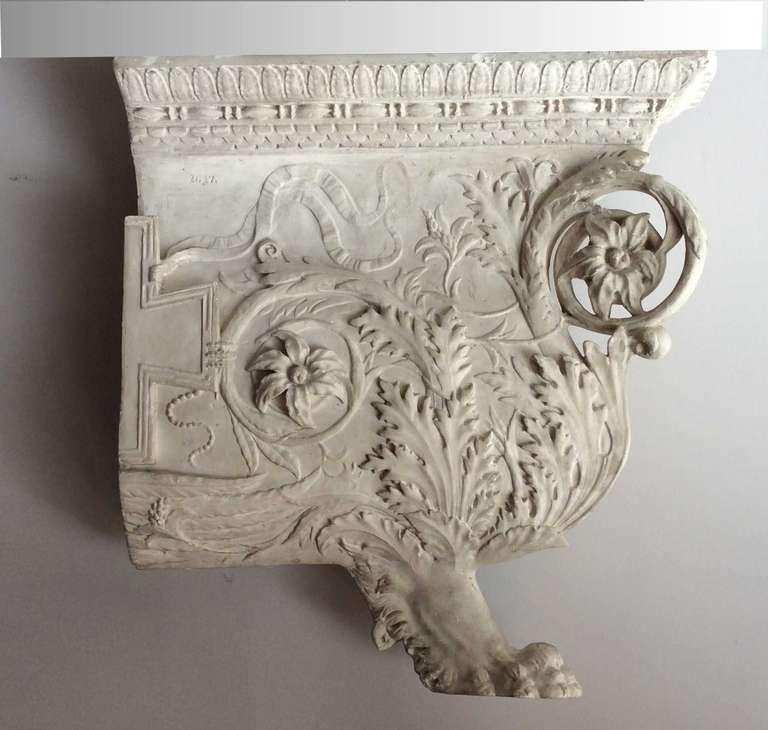 Beautiful and rare collection of plaster casts, models from a school of fine arts, late nineteenth century, France.

Model for cornice, with a decor of arabesques and flowers, and lion's paw.