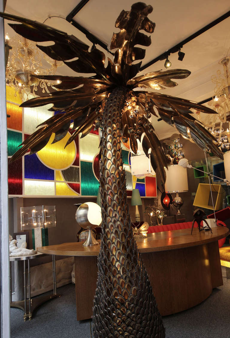 Coconut palm floor lamp in gilded iron and brass. Maison Honore in Paris circa 1970. Four bulbs are hidden beneath the foliage. Very rare model.