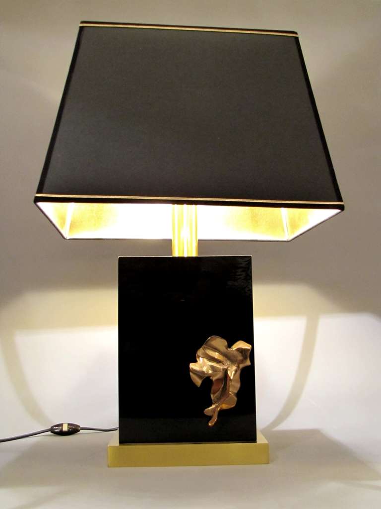 Two 1970's lamps in black Plexiglas and brass, with contemporary lampshades in black fabric with gilt interior.
Dimensions without lampshade are:
Height: 45 cm
Width: 23 cm