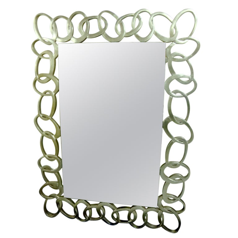 Miroir "arabesques" argenté. en vente