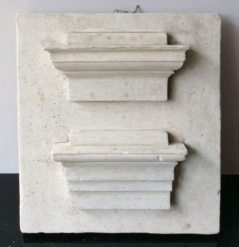 Small plaque with two cornice's models in plaster, France XIXth century