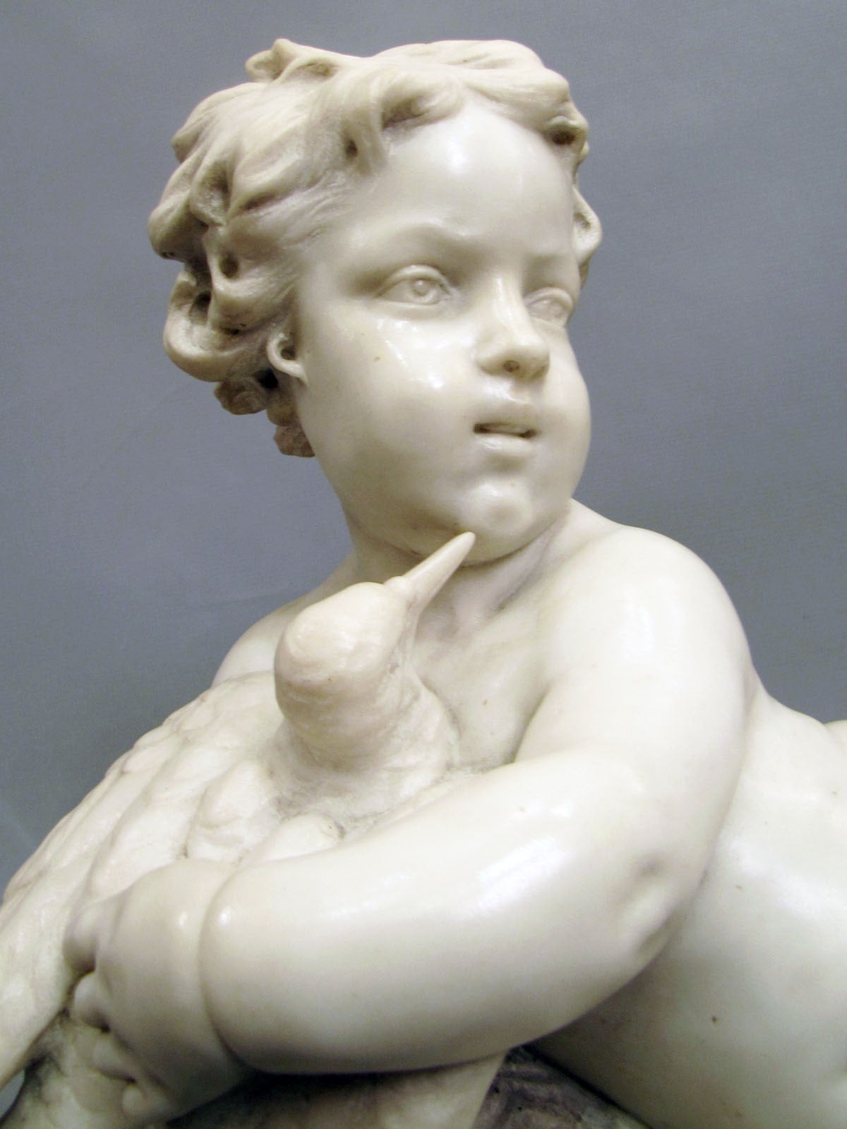 Carrara marble sculpture depicting a child with a bird, decorated with a frieze of gilded bronze beads in the style of the 18th century. 
Signed F. Jovino on the base.

 Félix Jovino (born in1882). Italian school, student of the Academy of