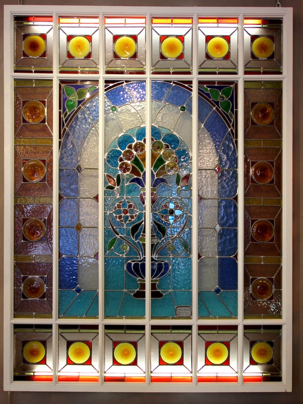 Stained glass panel by Carlo Pizzagalli, master glassmaker who participated and won several awards including the Universal Exhibitions of Paris in 1889 and 1900. A special support was made for this stained glass panel. 
It can be used in