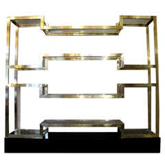 Important Italian 1970's polished brass shelves or bookcase, with glass levels