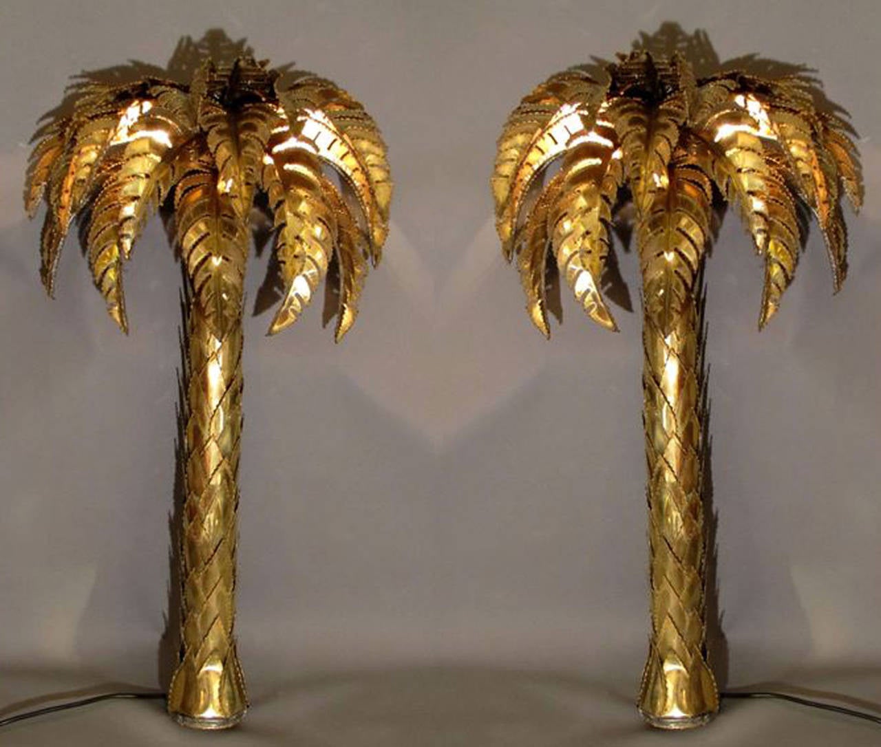 Beautiful pair of 1970s palm tree wall lights in hand-worked and polished brass.