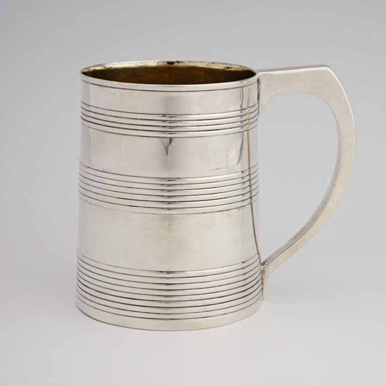 This Georgian Sterling Silver mug or cann is by the queen of silversmiths, Hester Bateman. Date marked for1787-1788, it has a pleasing tapered form with squared handle.

REMARKS FROM LAWRENCE JEFFREY: 