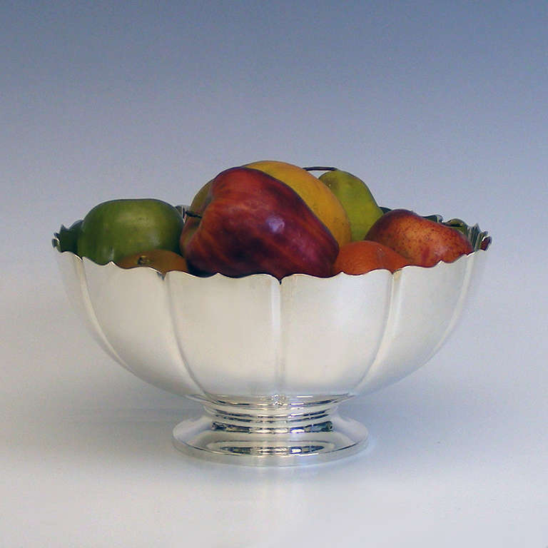 This Art Deco centerpiece bowl is a perfect mid to larger sized centerpiece. The lyrical lobed form presents an urbanely clean look with a wonderful silhouette. Its visual presence is an ideal decorative foil for any number of interior styles.