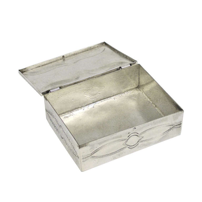 Decorated with traditional Concho motifs, this 1950s Navajo box is fabricated in sterling using traditional techniques. The look is organic chic.  

Remarks From Lawrence Jeffrey:  