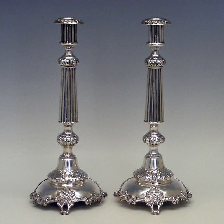 These circa 1910, .875 fineness silver candlesticks are wonderful turn of the century examples of Russian silver. They are very tall at just over 14 inches and incorporate classical and naturalist decorative elements.

HALLMARKS:  Kokoshnik,