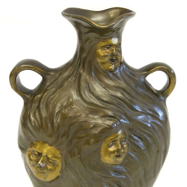 Circa 1900, Georges Charles Coudray, France.  This Art Nouveau vase, with its faces peering out from a profusion of hair, witnesses the more pensive side of the Belle Époque.   

HALLMARKS:  G. Coudray

WEIGHT:  14.88 ozt

Remarks from