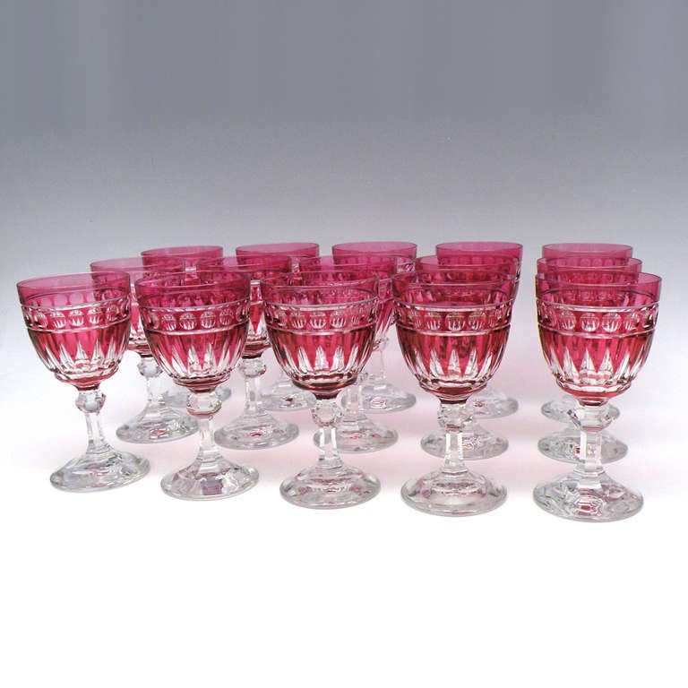Circa 1920s, Val St. Lambert, Belgium. These ruby cut to clear water glasses have a visually powerful geometric Art Deco design. Perfect today also for wine, the crisp colorful appearance telegraphs the hand cut quality Val St. Lambert is still