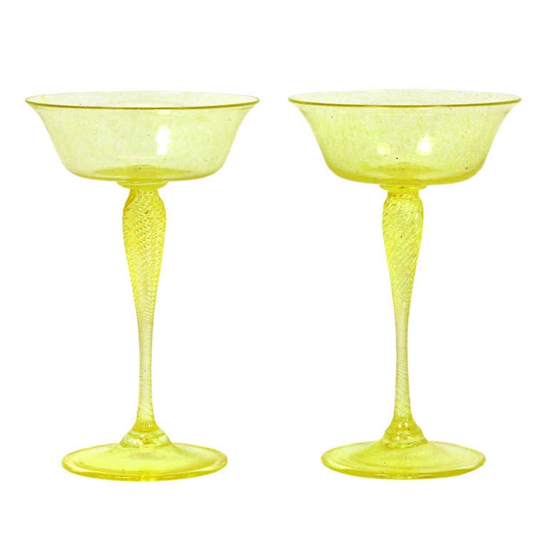 This set of 13 Venetian champagne glasses has a delicate yellow green color. They are superb quality, hand blown, well figured, and especially tall for the form.  Excellent condition.

SIZE:  6 1/2