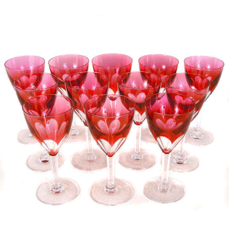 Circa 1950s, Val St. Lambert, Belgium.  Set of 12 cranberry cut to clear water goblets by Val St. Lambert in the 