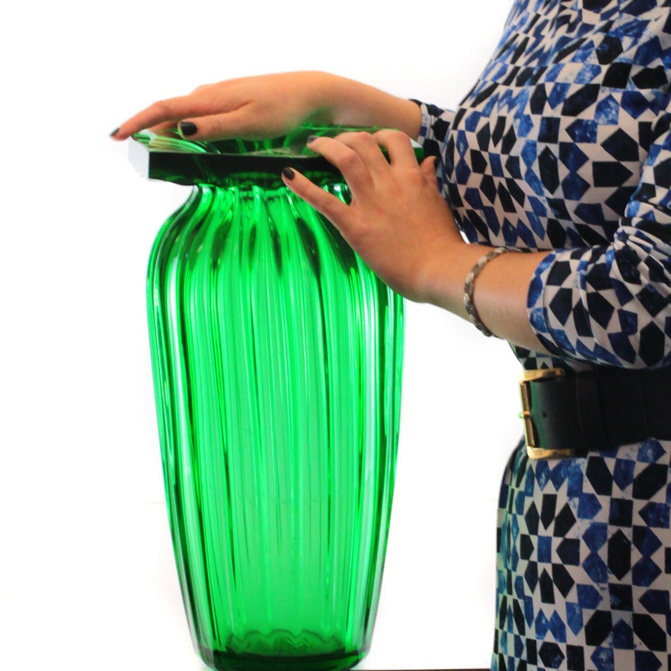 Daum Nancy, France, circa 1930s, this important Art Deco vase by Daum Nancy has fabulous presence. Its vibrant emerald green color and fluted shape give it a subtly organic feel, while the thick, modernist ruffle or lip provides a lovely visual