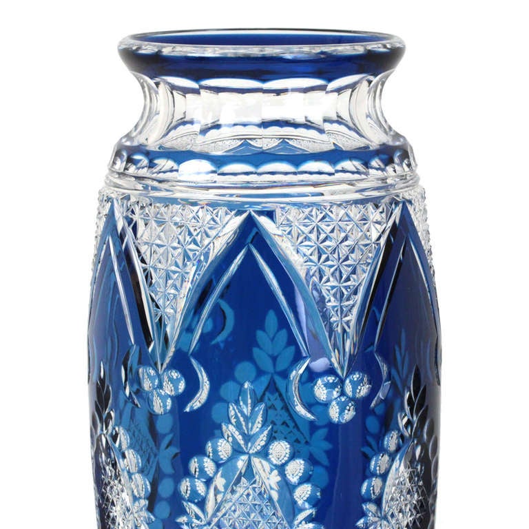 This gorgeous pair of Art Deco cut to clear crystal vases in the scarce royal blue color were designed in the 1920s by Joseph Simon. Pictured in the book 