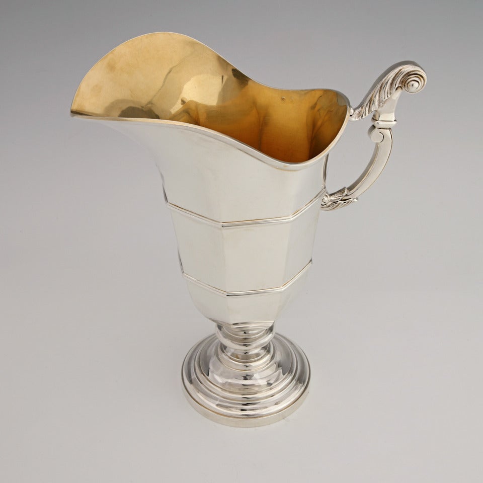 950 standard silver, French, circa 1920s. Art Deco pitcher. This French wine pitcher is a marvelously sleek Art Deco interpretation of a classical helmet motif ewer. The gilded interior indicates its primary use was for wine, though it was certainly