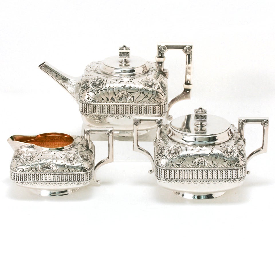 Sterling, Gorham, circa 1879s. This extraordinary diminutive or tête-à-tête tea service can only be described as gorgeous. The Japanese aesthetic design is visually crisp and as au courant today as 150 years ago. Completely hand chased, the quality