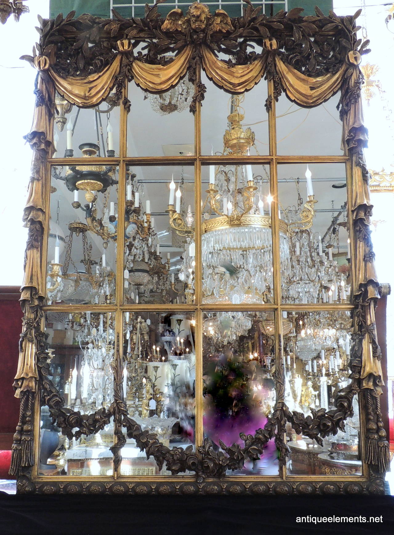 19 C GILT MIRROR WITH CHERUB & SWAGS 62 H x 44W (WINDOW PANE)
This wonderful center hall or full wall mirror is sure to be the center of attention in your home or place of business.  An extremely large 62