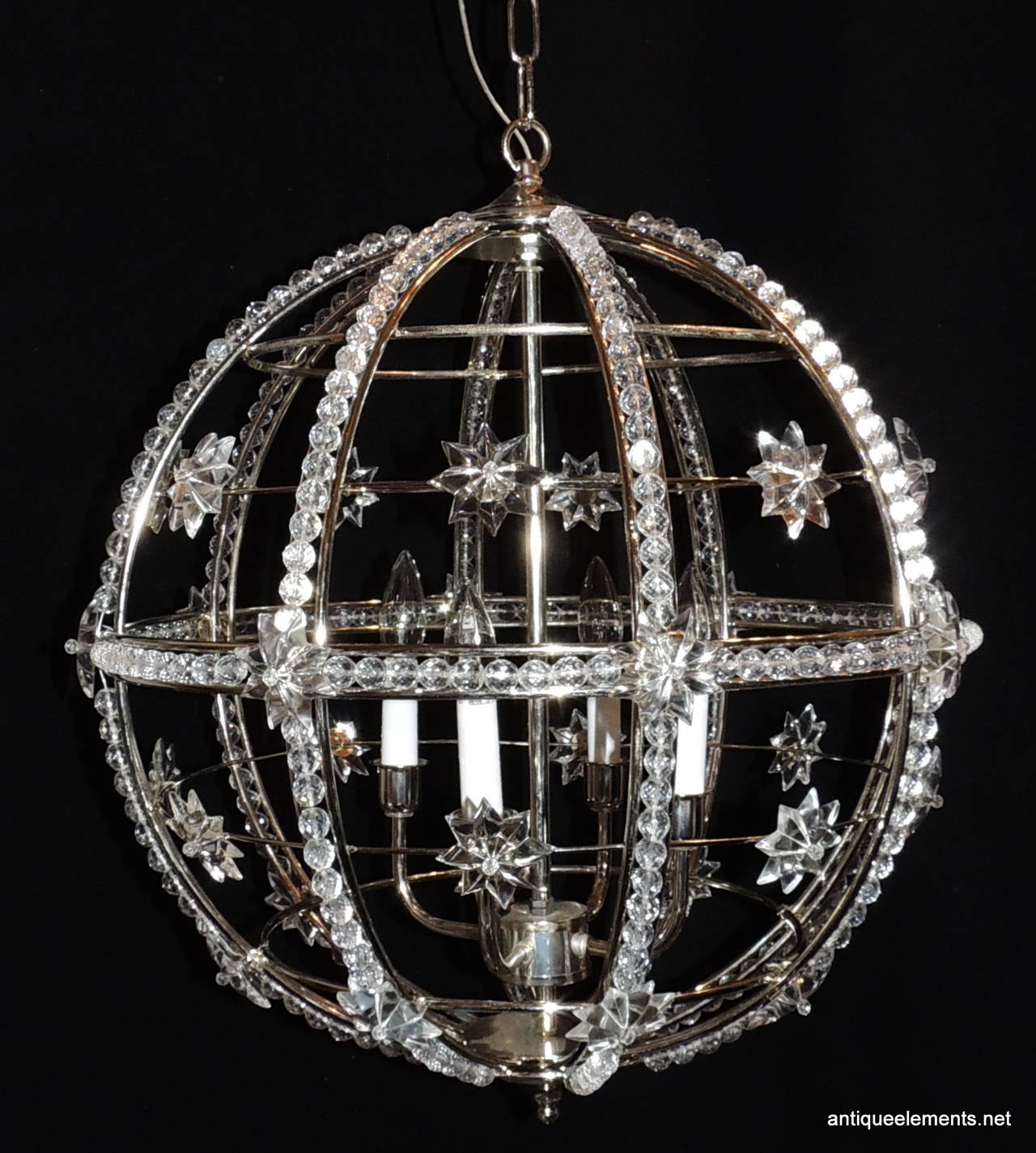 This modern Deco style Polished Nickel chandelier has beautiful crystal bead work surrounding the globe and is accented with crystal stars. There are 4 lights in the center of this wonderful chandelier.

A Pair Is Available...

20