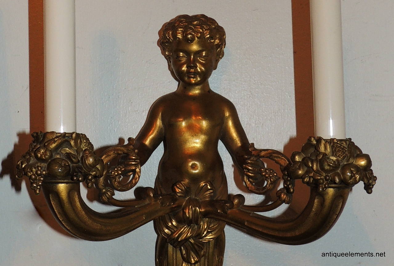 Wonderful Pair of French Doré Bronze Cherub Putti Figural Two-Arm Sconces In Excellent Condition In Roslyn, NY