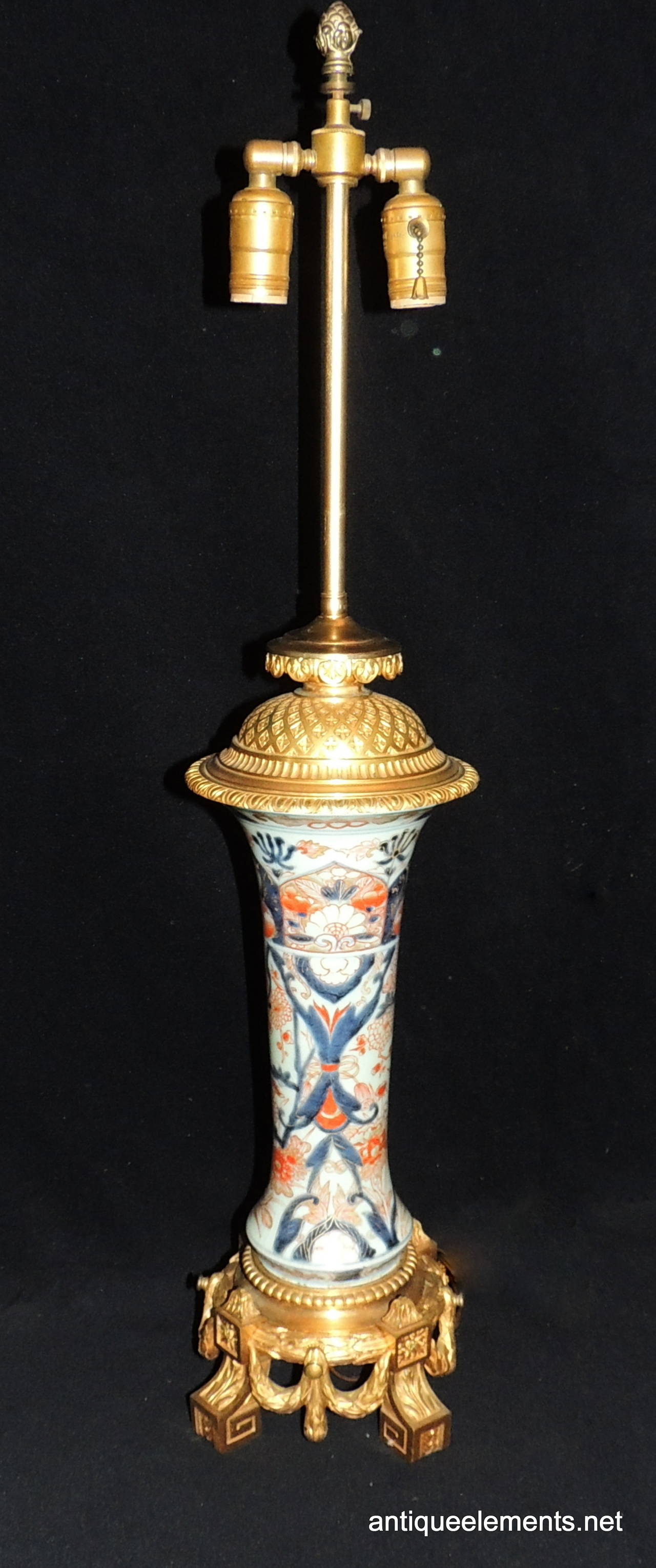A stunning pair of Imari hand-painted porcelain lamps with French doré bronze mountings. Newly Redone (sockets, wire).
