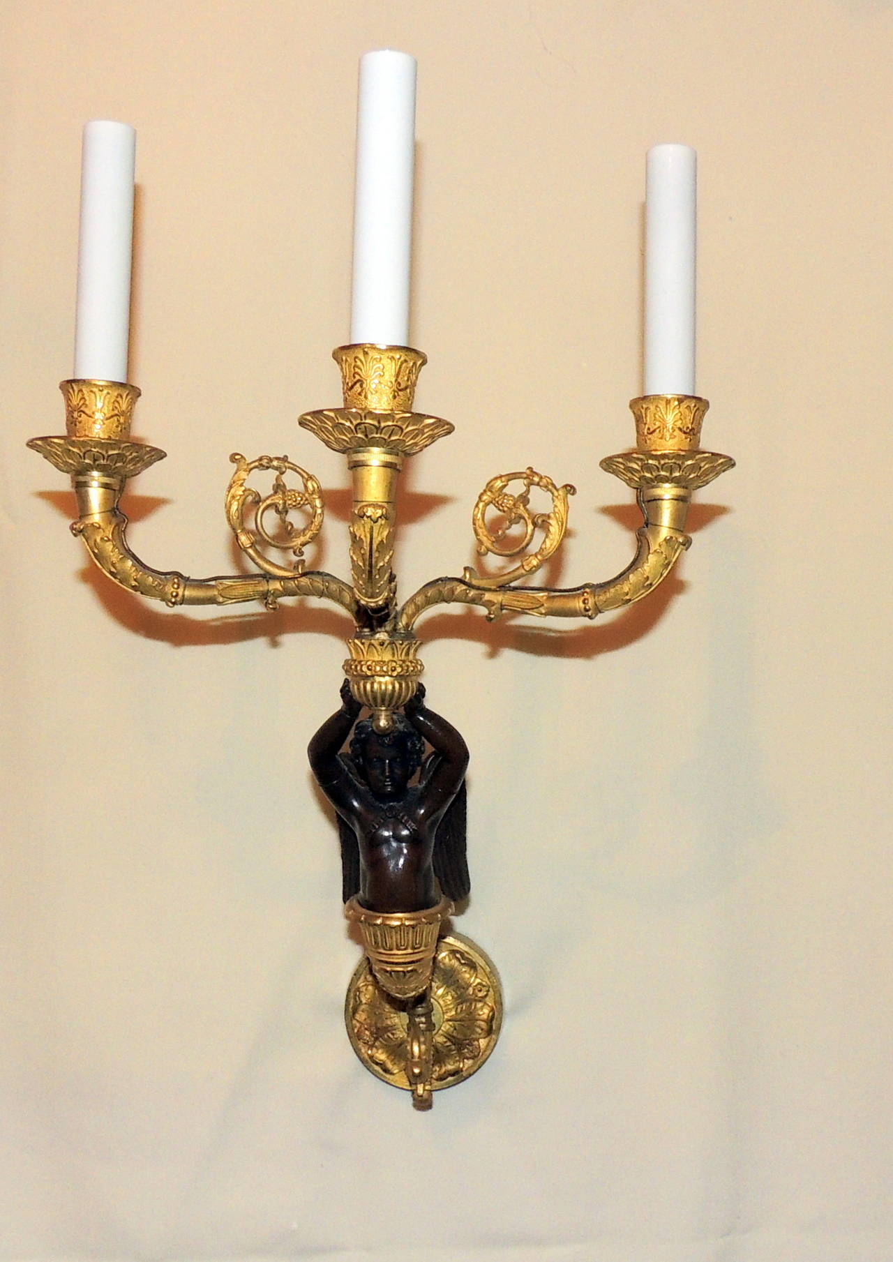 Pair of French Doré Bronze and Patina Three-Arm Cherub or Putti Sconces In Good Condition In Roslyn, NY