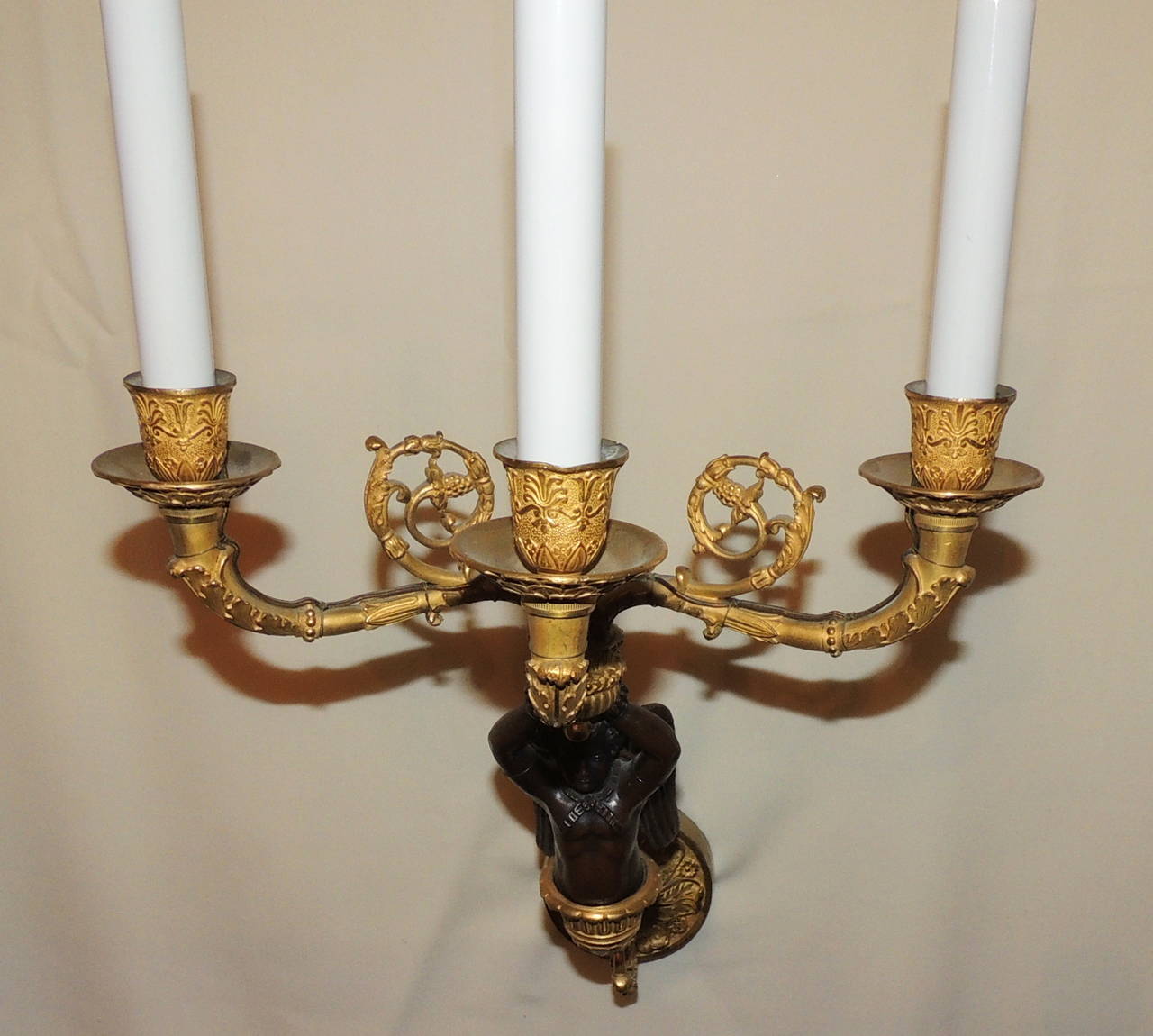 Early 20th Century Pair of French Doré Bronze and Patina Three-Arm Cherub or Putti Sconces