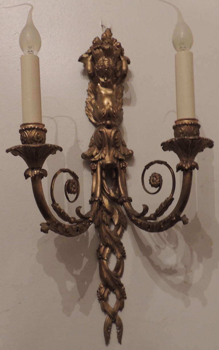 An Exquisite Pair Of Large Dore Bronze Cherub Putti Figural Two Light Wall Sconces By E.F. Caldwell. Incredible Detail And Craftsmanship To This Fine And Rare Pair.