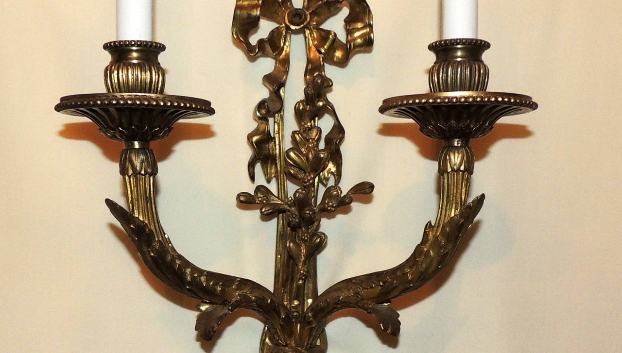 Early 20th Century Fine Pair of Elegant French Doré Bronze, Two-Arm Bow Top Sconces