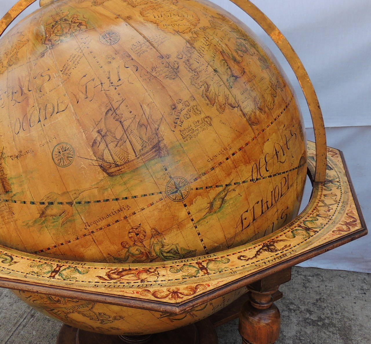 This monumentally large & Wonderful vintage World Globe with Celestial Markings around the frame is sure to be a wonderful centerpiece in that special room. The top of the frame is marked with the astrological signs.  A wonderful aged patina with