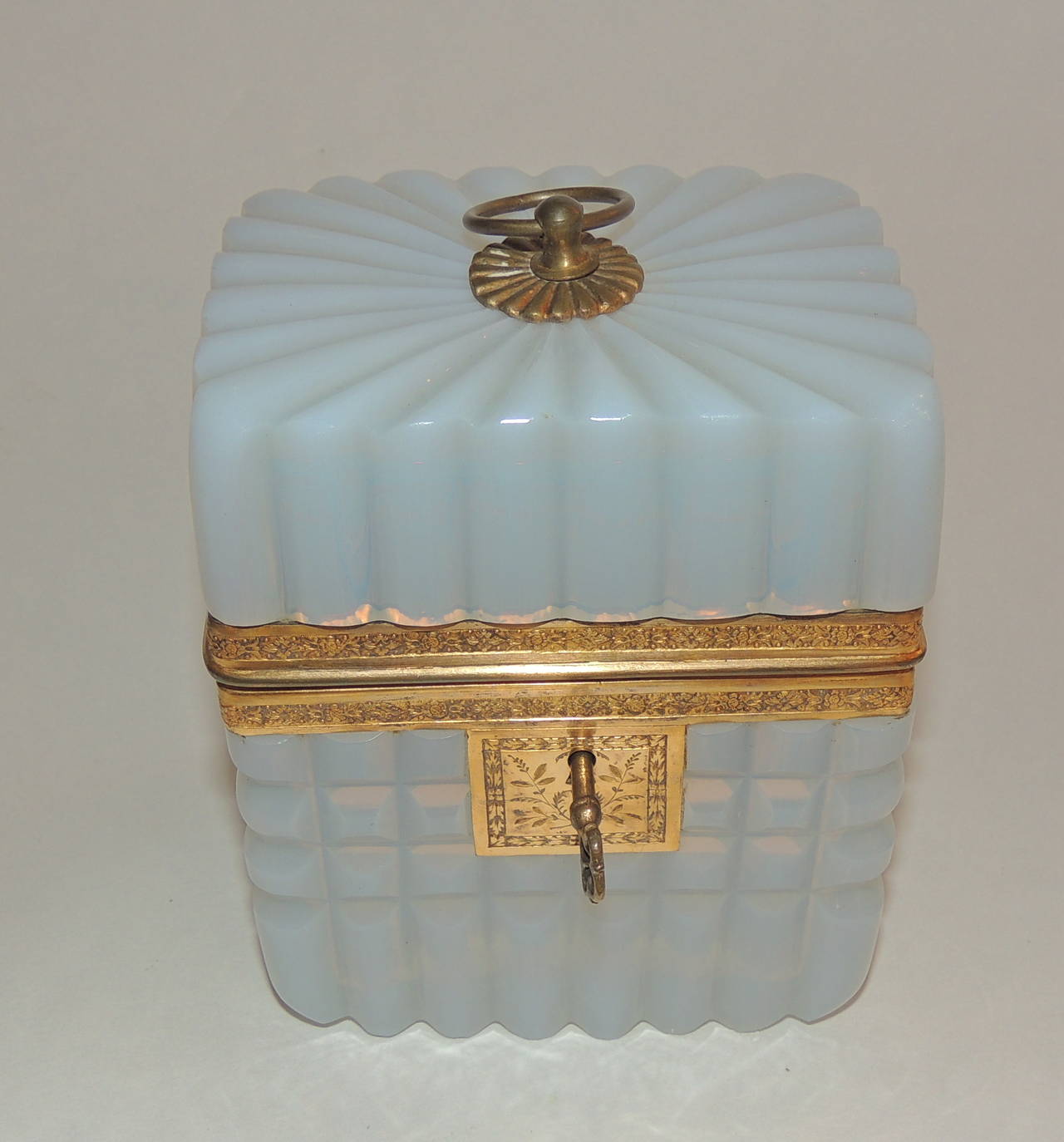 Beautiful French ribbed opaline glass casket box with dore bronze Ormolu engraved mounts with working key. 
4