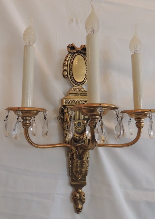 An Elegant Pair Of Caldwell Dore Bronze & Crystal 3 Arm Bow Top Sconces In Excellent Condition In Roslyn, NY