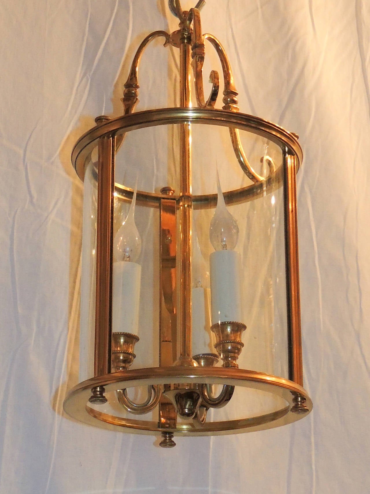 Outstanding Pair Of Gilt Bronze Louis XVI Lanterns Fixtures With Curved Glass Panels, In The Duncan Phyfe Style. Each Set With Three Lights Inside

Available as a pair or individually

18