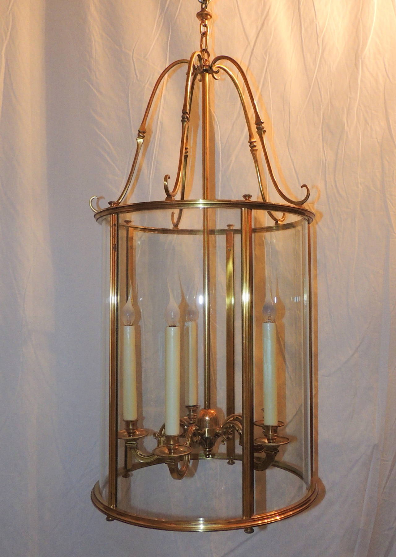 This five-light lantern with beautiful curved glass will set the mood in your room, entryway or porch with its large 20" height and 16" width the full length of the lantern from crown to edge is 34". Beautiful floral engraving