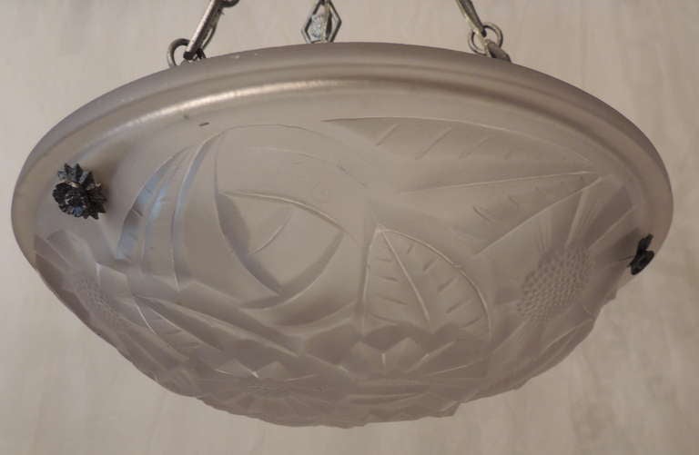 Art Deco silvered bronze and glass three-light fixture. Glass is embossed with flowers and leaves.