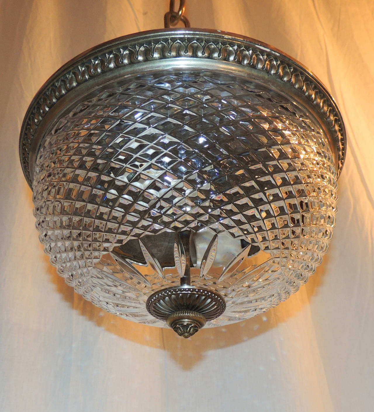This trio of Caldwell flush mounts are perfect for the larger space, over a long island or down a hallway. Or to just give wonderful light in your room. Beautiful cut crystal dish with star center centered on a silvered bronze rim embellished with