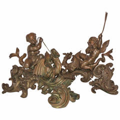 A Museum Quality Pair of French Bronze Cherubs Riding Winged Dragons Chenets