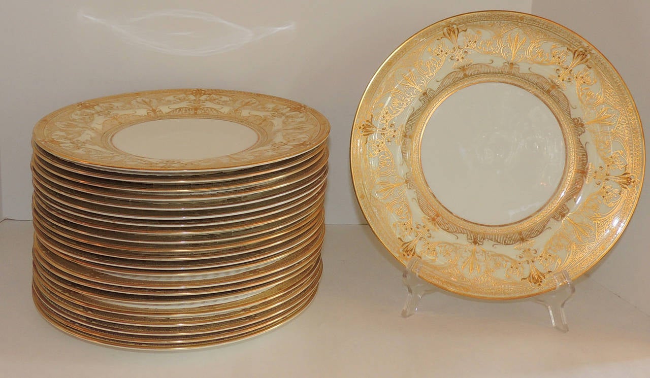 Perfect for the large gatherings, vintage set of  24 Royal Worcester gold encrusted rim dinner plates on ivory china.

Marked with Royal Worcester Trademark
#1705 in hand painted red 

6W BA in the porcelain