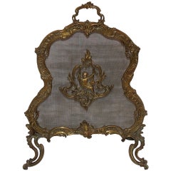 Antique Sweet French Gilt Bronze Fireplace Screen Depicting a Swinging Cherub Firescreen