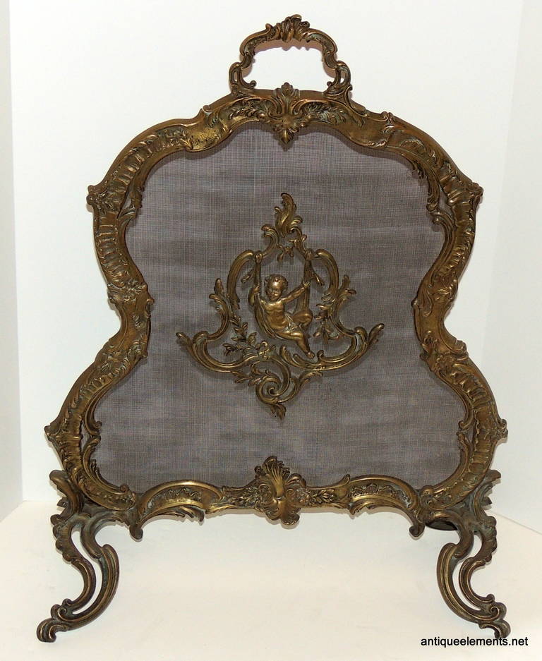 If cherubs are your desire, this endearing fire screen has solid scroll work and the swinging cherub in the center of beautiful bronze scroll with floral touches. Measure: The screen is a narrow 22" width, perfect for the smaller fireplaces.