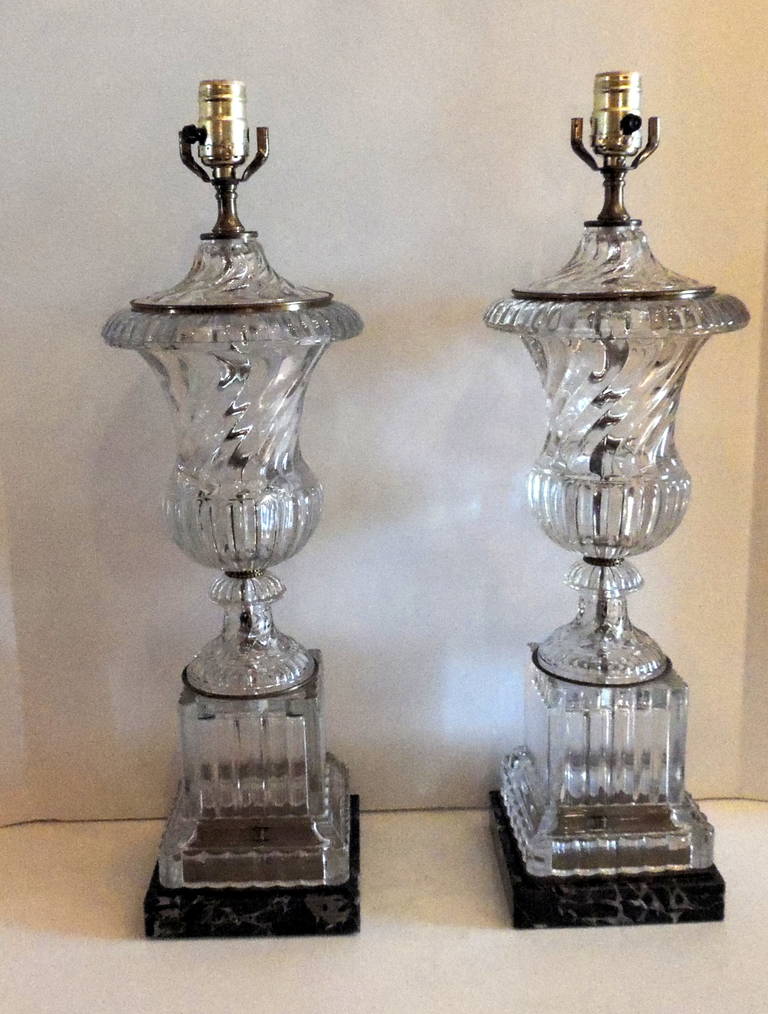 This pair of Baccarat style lamps with the beautiful swirled crystal pattern will add a wonderful elegance touch to your home.  With a substantial size of 23