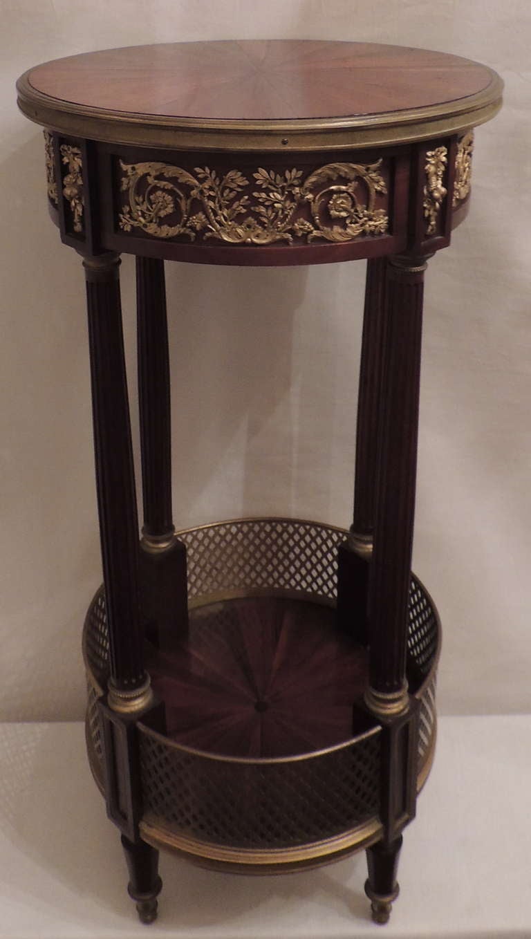 A very fine 19th century French rosewood and mahogany ormolu-mounted table with gallery lower tier.