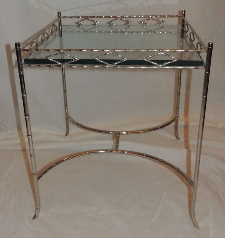 A wonderful silvered bronze bamboo side table with glass top
attributed to Mason Bagues.